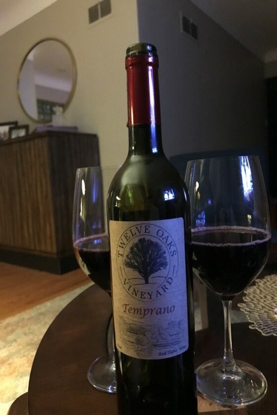 https://twelveoaksvineyard.com/wp-content/uploads/Celebrating-the-purchase-of-a-new-home-with-a-bottle-of-Temprano-Kyle-and-Nicki-Richmond-Heaights-MO-rotated.jpg